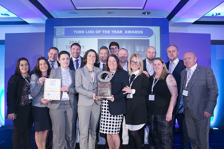 Representatives from Gatwick Airport receive the Overall Tork Loo of the Year Award Trophy at the annual Loo of the Year Awards Presentation, held on Friday 2nd December.